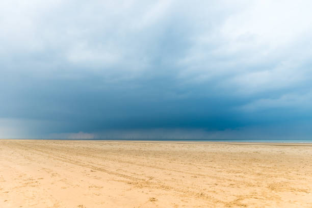 Sunrise Seascape with rain clouds at Bilgola Beach on the Northern Beaches of Sydney, NSW, Australia.