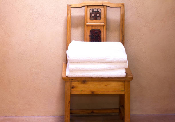 istock Bathroom Detail: Antique Wooden (Asian) Chair with Stack of Towels 841416162
