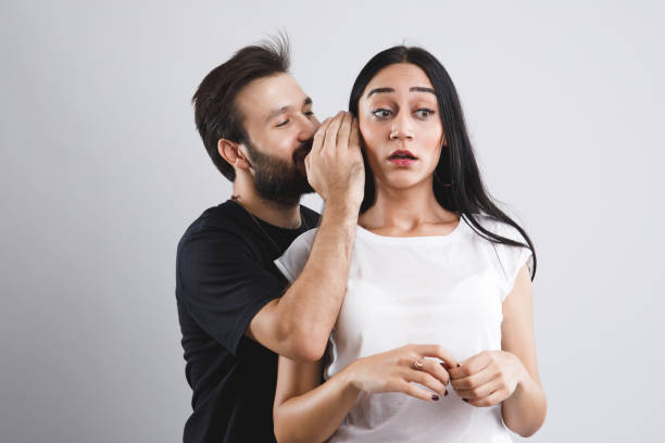 istock Young couple gossiping in studio shots 841419106