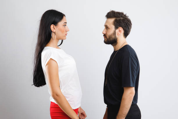 istock Young man and woman looking to each other 841422078