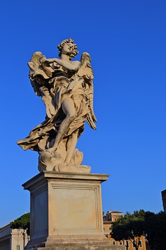 angel statue of the Ancient bridge in front of Castel Sant Angelo, Rome - Italy