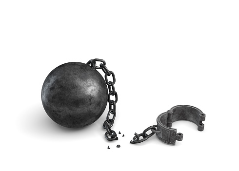 3d rendering of an isolated ball and chain lying broken near a leg shackle