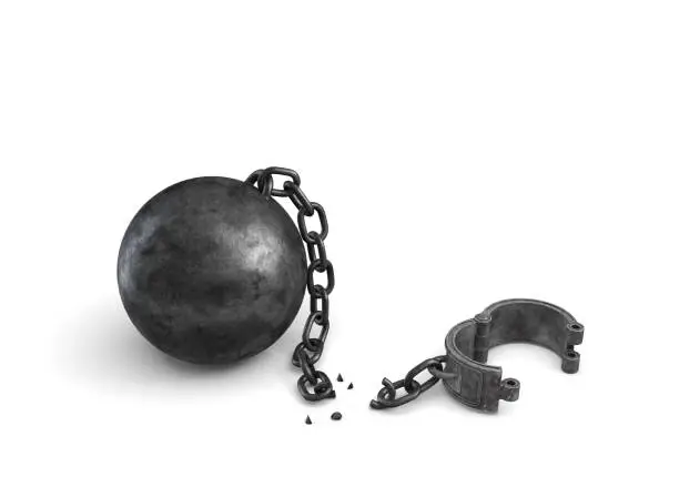 Photo of 3d rendering of an isolated ball and chain lying broken near a leg shackle