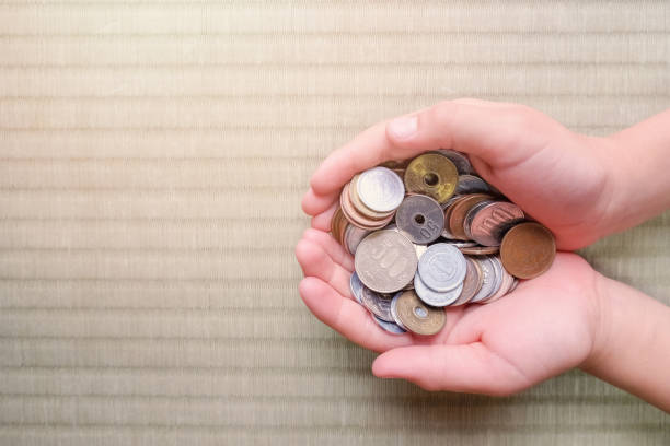 istock child hands with Japanese money, copy space background 841426420