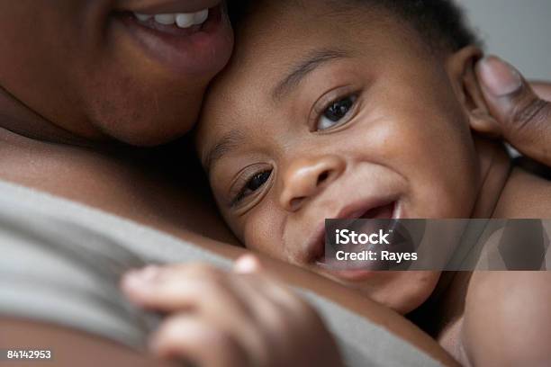 Baby Being Cuddled By Mum Smiling Stock Photo - Download Image Now - Baby - Human Age, Mother, Embracing