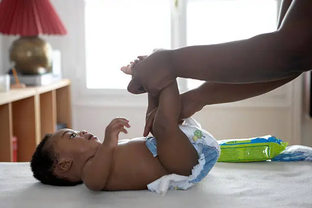 Photo of baby having his nappy changed