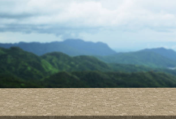 istock Cobblestone table top on blurred mountains landscape background can put or montage your products 841437976