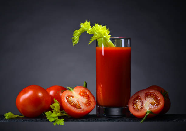 istock Tomato juice with tomatoes and celery sticks 841441524