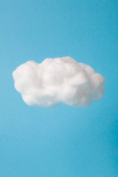 Photo of cloud made out of cotton wool on sky blue background