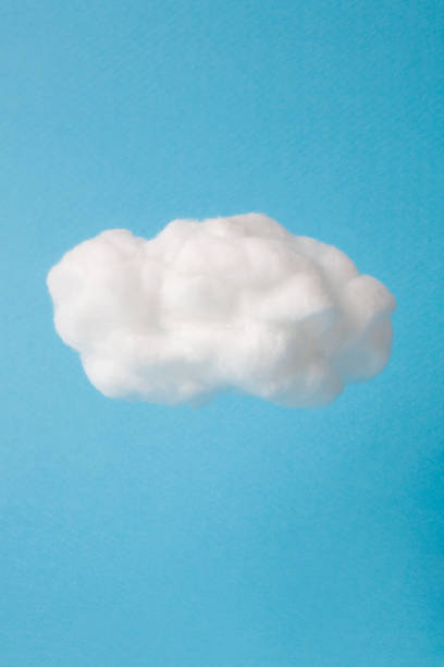 cloud made out of cotton wool on sky blue background cloud made out of cotton wool on sky blue background. cotton cloud stock pictures, royalty-free photos & images