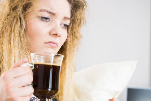 istock Tired woman drinking her morning coffee 841446222