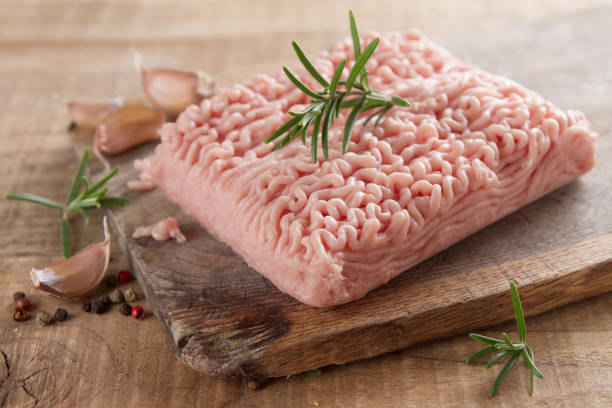 Minced chicken or turkey meat stock photo