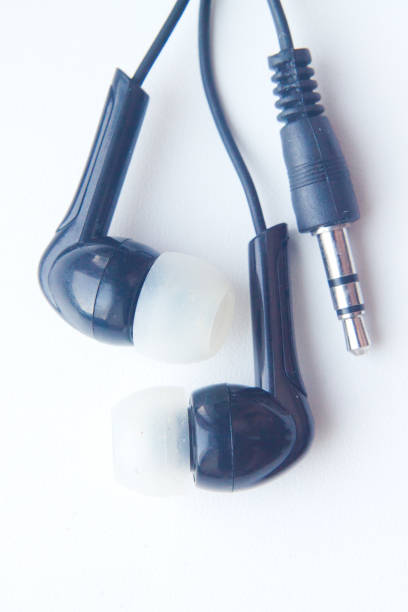 istock black mini Headphones for player or phone on white background. Close-up 841453964