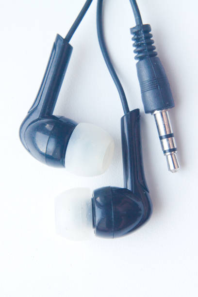 istock black mini Headphones for player or phone on white background. Close-up 841454002