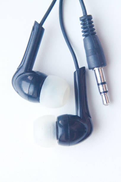 istock black mini Headphones for player or phone on white background. Close-up 841454062