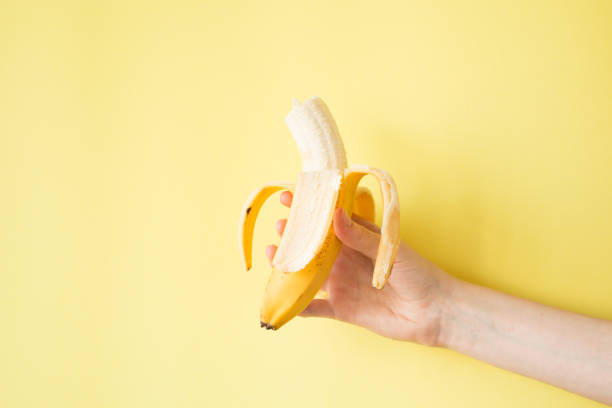 istock Human Hand Holding Banana Fruit Nutrition Concept 841456754