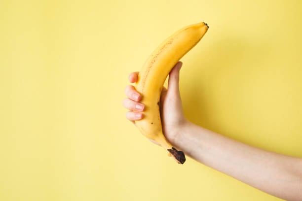 istock Human Hand Holding Banana Fruit Nutrition Concept 841456778