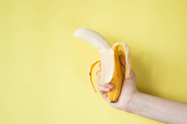 istock Human Hand Holding Banana Fruit Nutrition Concept 841456806