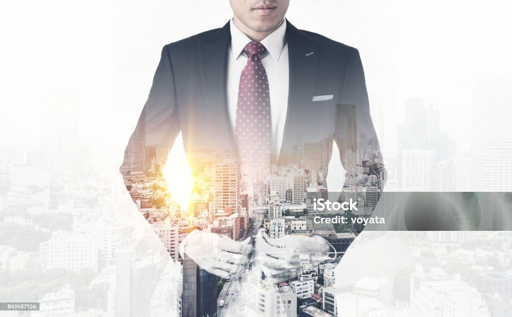 modern office man with dark suit, double exposure effect with Japan city skyline background Asia business concept - thoughtful modern office man with dark suit, stand and think the business plan. Double exposure effect with Japan city skyline background Achievement Stock Photo