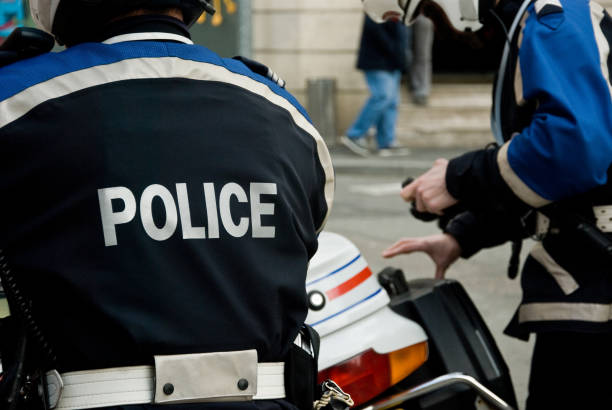 french policeman with motorcycle back stock photo