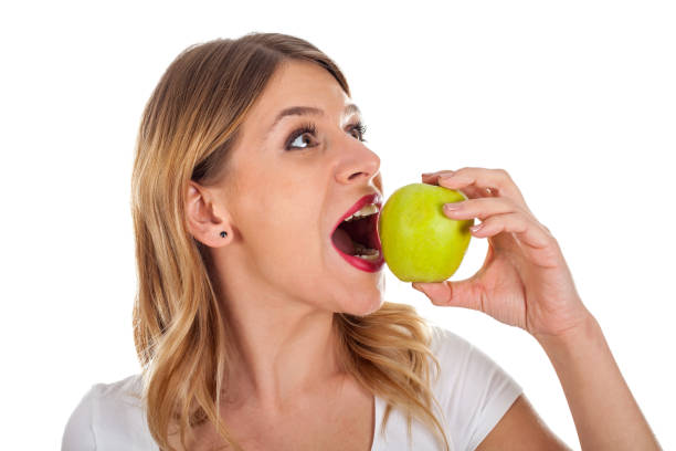 istock Young girl on diet holding a green apple 841462882