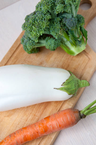 istock Still life of vegetables: broccoli, carrots and white eggplant 841469276