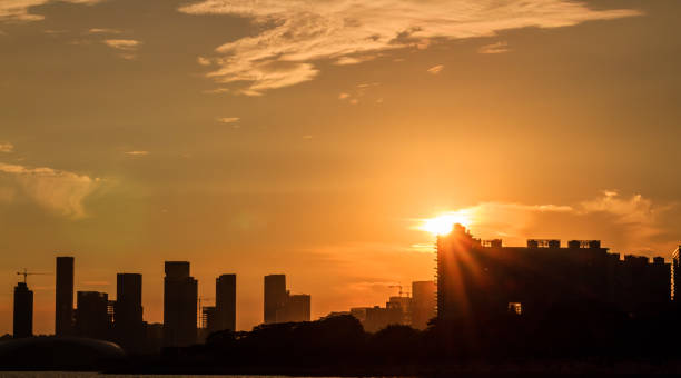 istock Sunset in a seaside city with orange sky 841475082