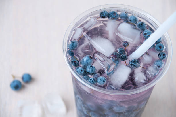 istock Blueberry cocktail with ice cubes closeup 841475122