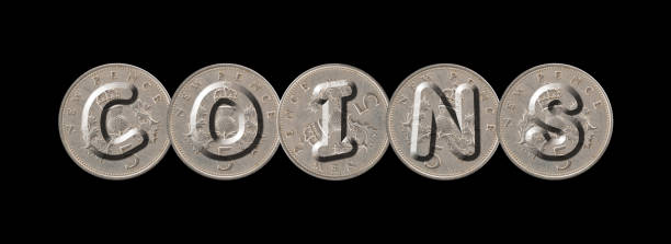 istock COINS word with five new pence coins on black background 841475626