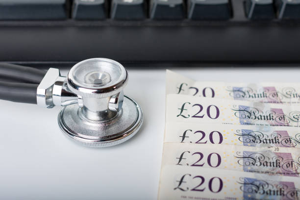 istock Stethoscope,money, keyboard on white, medical concept. 841478474