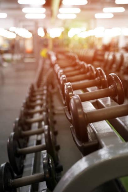 istock Different dumbbell weights in fitness center 841478982