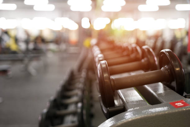 istock Different dumbbell weights in fitness center 841479106