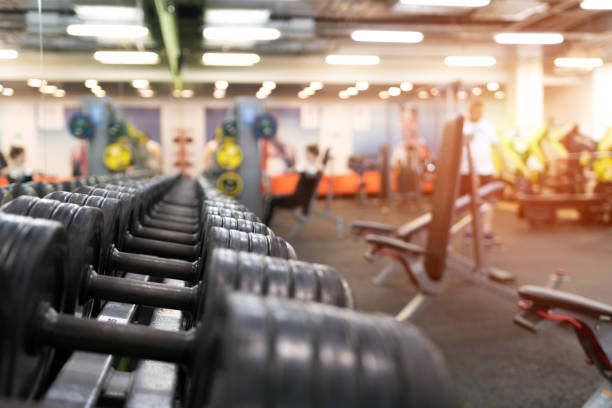 istock Different dumbbell weights in fitness center 841479586