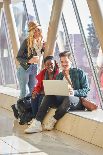 istock 3 young adults entrepreneurs or students group mixed race around laptop having a discussion 841481760