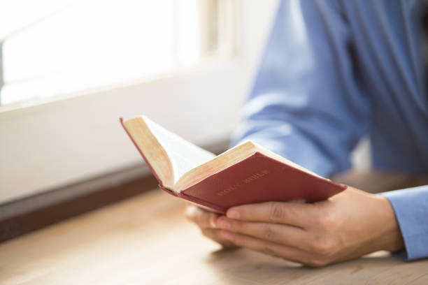 istock A man reading the Holy Bible. 841482340