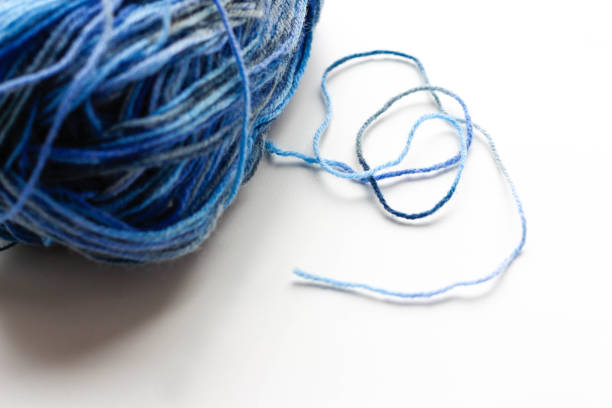 istock A ball of blue wool yarn. Closeup. Isolated on white background 841486716