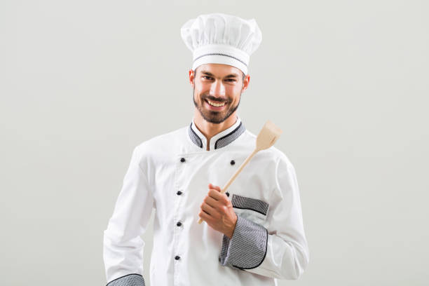 istock Portrait of chef with wooden spoon 841494028