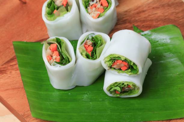 istock spring roll with vegetable on banana leaf wood floor background , Select focus  shallow depth of field. depth of field. 841495424