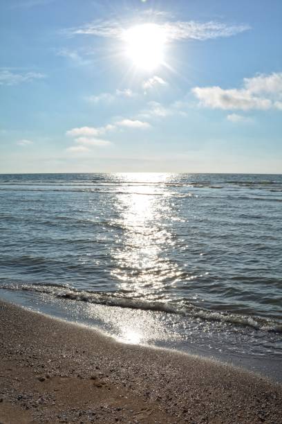 istock Waves in the sea with sun 841503016