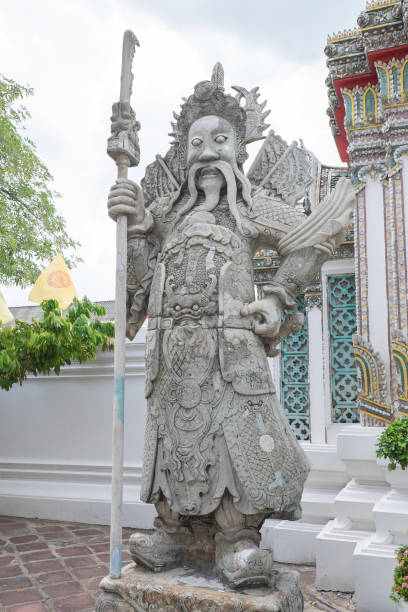istock ancient stucco chinese doll in thai temple 841518174