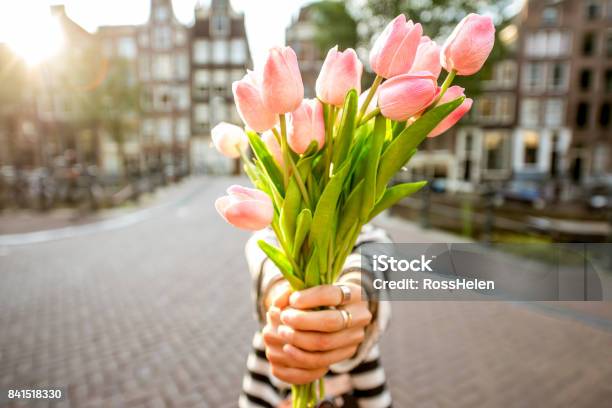 Woman With Tulips In Amsterdam City Stock Photo - Download Image Now - Tulip, Bouquet, Flower