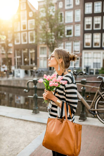 istock Woman walking in Amsterdam city 841519600