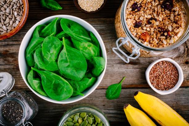 istock Ingredients for green spinach smoothies: bananas, granola, chia seeds 841522738