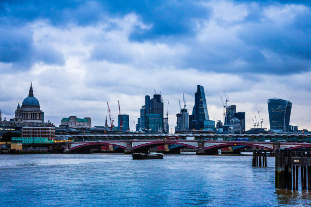 istock Modern London Urban Skyline and River Thames at Dusk 841527880