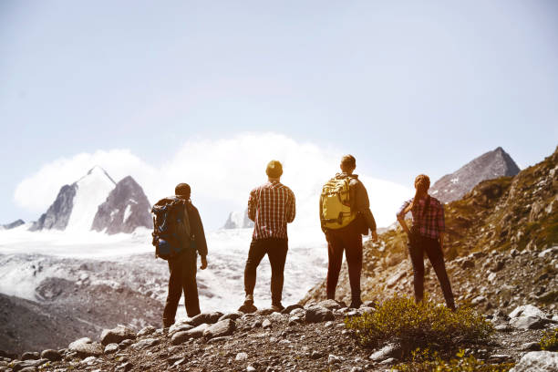 istock Group four friends trekking mountains 841534204