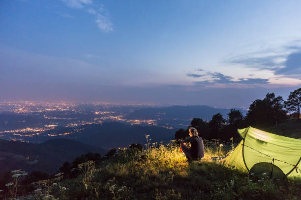 istock Man hiker camping at sunrise 841534262