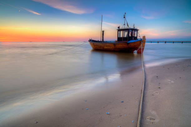 istock Fishing boat on the Baltic Sea beach 841534306