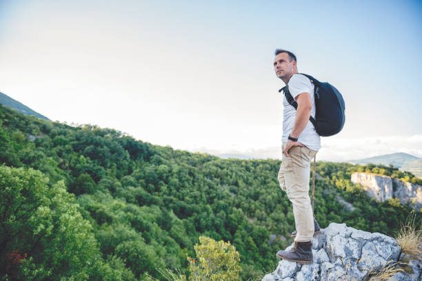 istock Hiker standing on the mountain top 841534362