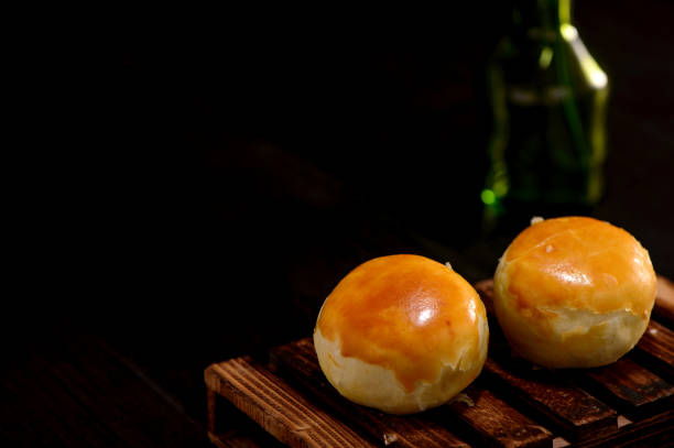istock yolk pastry(Egg yolk shortcake) on wooden table isolated on black   backgrond 841535598