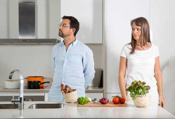 istock couple preparing food in a kitchen 841539362